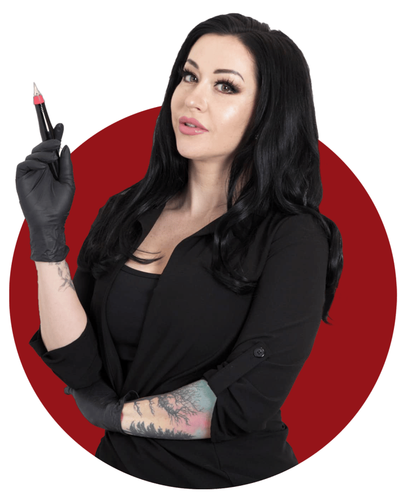 Tara Rebel holding a permanent makeup machine at Rebel Aesthetics in New Jersey.