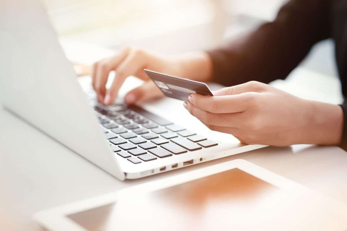 Paying by card on a laptop