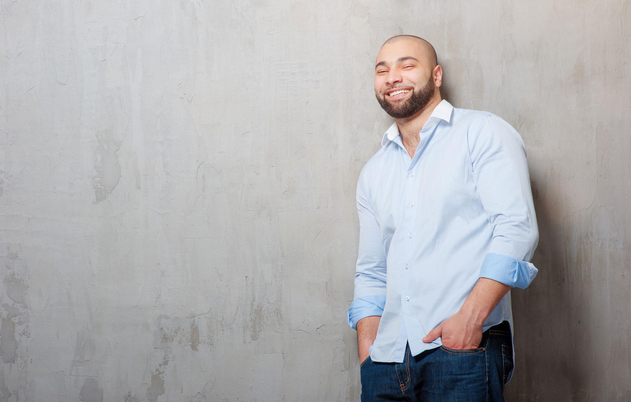 Smiling man with a shaved head